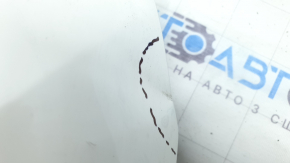 The upper grille cover of the Mazda CX-9 16-23 is dented, scratched, and worn.
