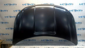 The hood of a Ford Explorer 16-19 is bare, aluminum, dented.