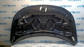 The hood of a Ford Explorer 16-19 is bare, aluminum, dented.