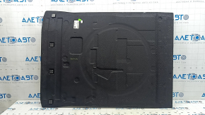 The trunk floor of the BMW 5 G30 17-23 is black and creased.