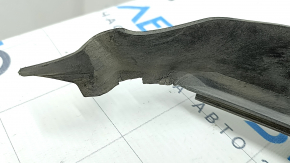 The plastic windshield wiper grille of a BMW 5 G30 17-23 has dried out rubber.