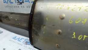 The left exhaust pipe with catalytic converter for a BMW X7 G07 19-22 3.0T is dented.