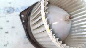 The heater fan motor on a Suzuki Kizashi 10-15 is cracked.