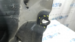 The front right rear fender liner of the BMW X7 G07 19-26 is dented and has tears.