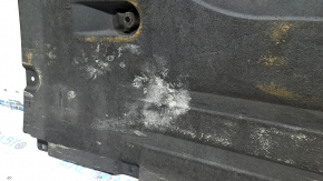 Front left underbody protection for BMW X7 G07 19-22 is dented and has tears