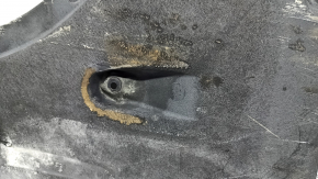 Front right underbody protection for BMW X7 G07 19-22 is dented and has tears
