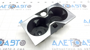 Cup holders for the front center console of a BMW X7 G07 19-22, black with chrome, worn, in need of cleaning
