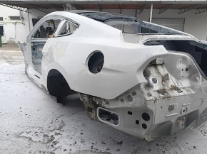 Rear left quarter wing for a Ford Mustang mk6 15-23 coupe, on the body, white, with bumps. Painted 0.25-0.3