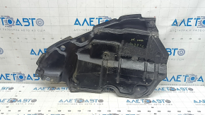 The lower right engine guard for a Toyota Camry v40 07-09 is torn and dented.