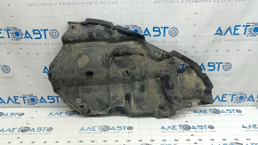 The lower right engine guard for a Toyota Camry v40 07-09 is torn and dented.