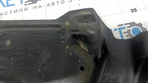 The lower right engine guard for a Toyota Camry v40 07-09 is torn and dented.