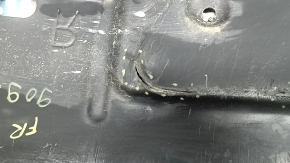 The lower right engine guard for a Toyota Camry v40 07-09 is torn and dented.