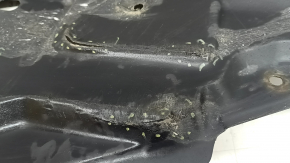 The lower right engine guard for a Toyota Camry v40 07-09 is torn and dented.