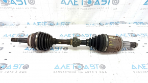 The front left drive axle shaft of a Toyota Camry V40 hybrid is rusty and the threads are dented.