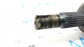 The front left drive axle shaft of a Toyota Camry V40 hybrid is rusty and the threads are dented.