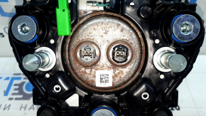 The Honda CRV 23-26 driver's steering wheel airbag is black, with a rusty squib cartridge and scratches.