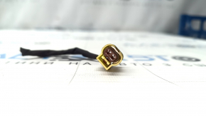 The front right airbag sensor chip for the 11-18 VW Jetta USA on a TV.