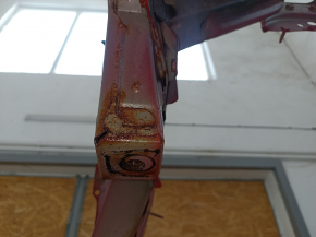 Front right quarter panel of a Toyota Camry v40, red, rusty, painted