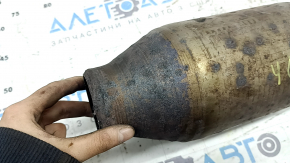 The rear catalytic converter of a Toyota Camry V40 hybrid has been cut off, without the downpipe.