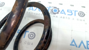 The front left spring of a Toyota Camry v40 is rusty.