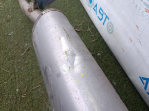 The exhaust pipe, the middle part with the barrel of the Honda CRV 23-26 HEV AWD, is crushed.