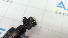 The left headlight washer nozzle on an Audi Q8 2024-26 is broken.