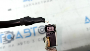 The negative battery terminal of the Audi Q8 19-23 with a sensor is oxidized.