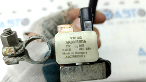 The negative battery terminal of the Audi Q8 19-23 with a sensor is oxidized.