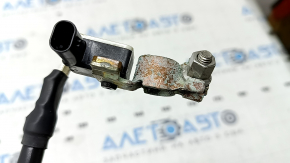 The negative battery terminal of the Audi Q8 19-23 with a sensor is oxidized.
