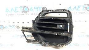 The front bumper grille, left, BMW X5 G05 19-23, under the parking sensors and fog lights, X-Line, is cracked.