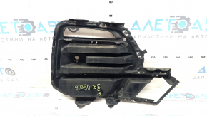 The front bumper grille, left, BMW X5 G05 19-23, under the parking sensors and fog lights, X-Line, is cracked.