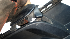 The front bumper grille, left, BMW X5 G05 19-23, under the parking sensors and fog lights, X-Line, is cracked.