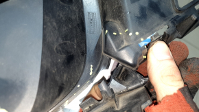 The front bumper grille, left, BMW X5 G05 19-23, under the parking sensors and fog lights, X-Line, is cracked.