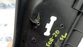 Subaru Forester 19-24 SK driver's seat control cover is black, with cracks in the fasteners.