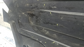 The rear left underbody protection of the BMW X5 G05 19-26 is dented.