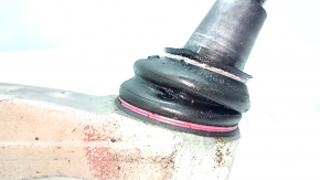The lower control arm, front left rear, Audi Q8 19-26, has a torn silent block and boot.