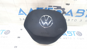 The driver's side airbag in the steering wheel of a VW Tiguan 22-24 is black and the plastic has turned white.