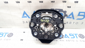 The driver's side airbag in the steering wheel of a VW Tiguan 22-24 is black and the plastic has turned white.