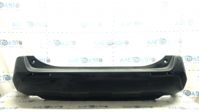 The bare lower part of the rear bumper of a Toyota Rav4 19-24 without parking sensors. The structure, scratches, sand, and whitened plastic are visible.