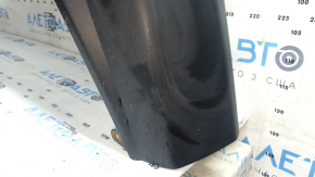 The bare lower part of the rear bumper of a Toyota Rav4 19-24 without parking sensors. The structure, scratches, sand, and whitened plastic are visible.
