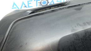 The bare lower part of the rear bumper of a Toyota Rav4 19-24 without parking sensors. The structure, scratches, sand, and whitened plastic are visible.