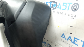 The bare lower part of the rear bumper of a Toyota Rav4 19-24 without parking sensors. The structure, scratches, sand, and whitened plastic are visible.