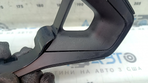 The steering wheel controls on a Toyota Rav4 19-23 without a heated steering wheel, black trim, and scuff marks.