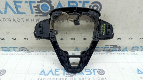 The steering wheel controls on a Toyota Rav4 19-23 without a heated steering wheel, black trim, and scuff marks.