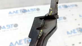 The rear bumper central mount for a Ford Fusion mk5 19-20 is broken and bent.