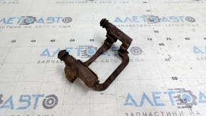 Rusty rear right caliper bracket for a 1920 Nissan Rogue
