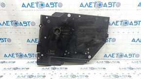 The right fuel tank guard for a Subaru Forester 25-26 is dented and torn.