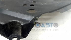 The right fuel tank guard for a Subaru Forester 25-26 is dented and torn.