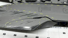 The Subaru Forester 25-26 trunk lid trim is broken, cracks, scratches, broken fasteners, a fragment is missing