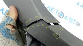 The Subaru Forester 25-26 trunk lid trim is broken, cracks, scratches, broken fasteners, a fragment is missing